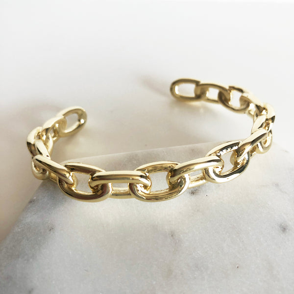 Chunky gold link chain cuff bracelet display