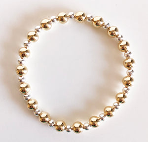 6mm gold and 4mm silver alternating beaded bracelet flat lay display