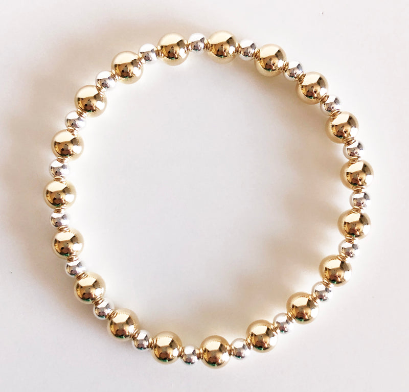 6mm gold and 4mm silver alternating beaded bracelet flat lay display