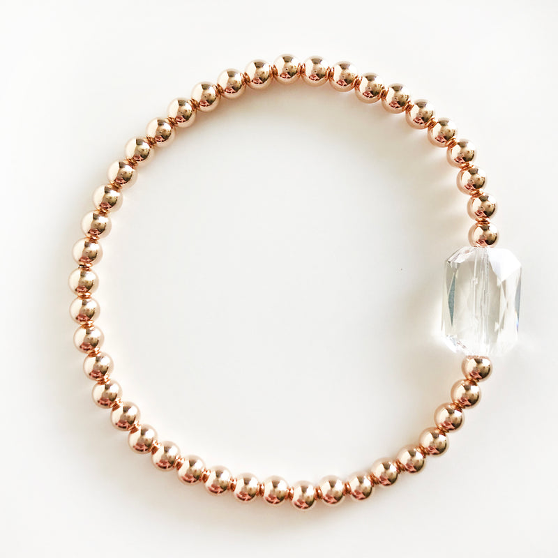 14k Rose Gold-Filled beaded bracelet with emerald Swarovski crystal in clear
