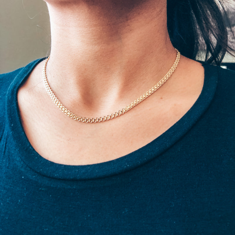 model photo wearing 14k gold-filled multi-layer thick chain necklace