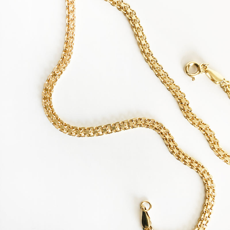 up close detail photo of 14k gold-filled multi-layer thick chain necklace