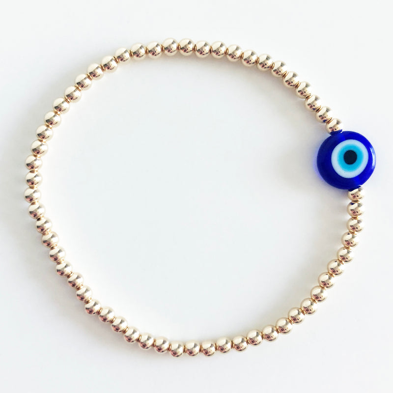 blue evil eye bead on 3mm 14k gold-filled beaded bracelet