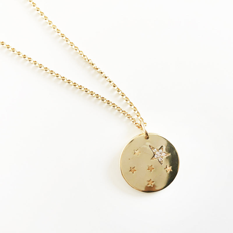14k gold-filled chain coin necklace with star cutouts and CZ