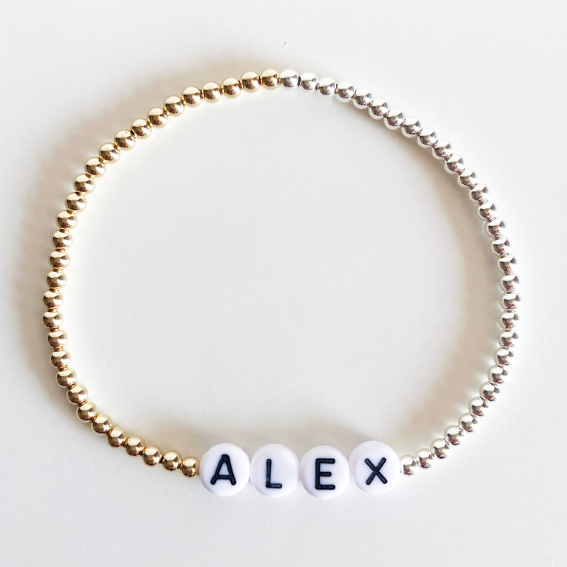 Mixed metal beaded name bracelet gold and silver with white letter beads