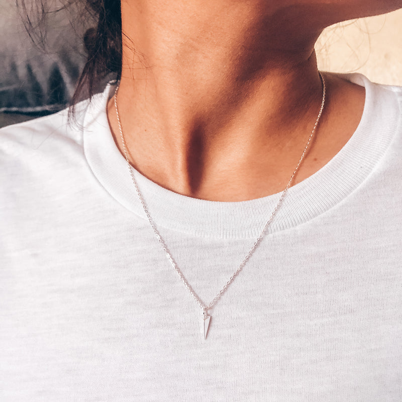 Model photo wearing Sterling Silver chain necklace with arrow point charm