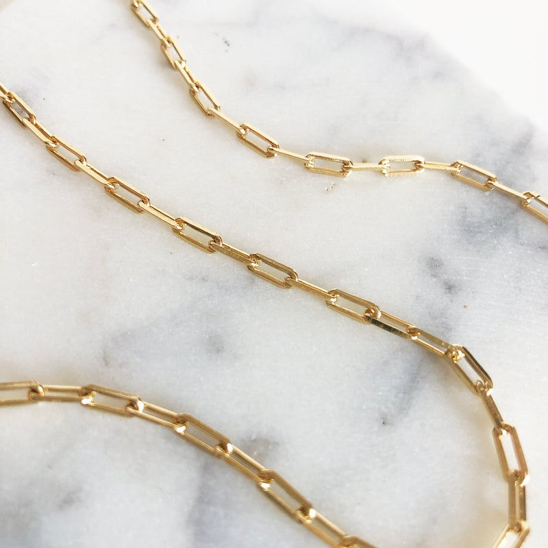 Close up view of Osiris gold link chain
