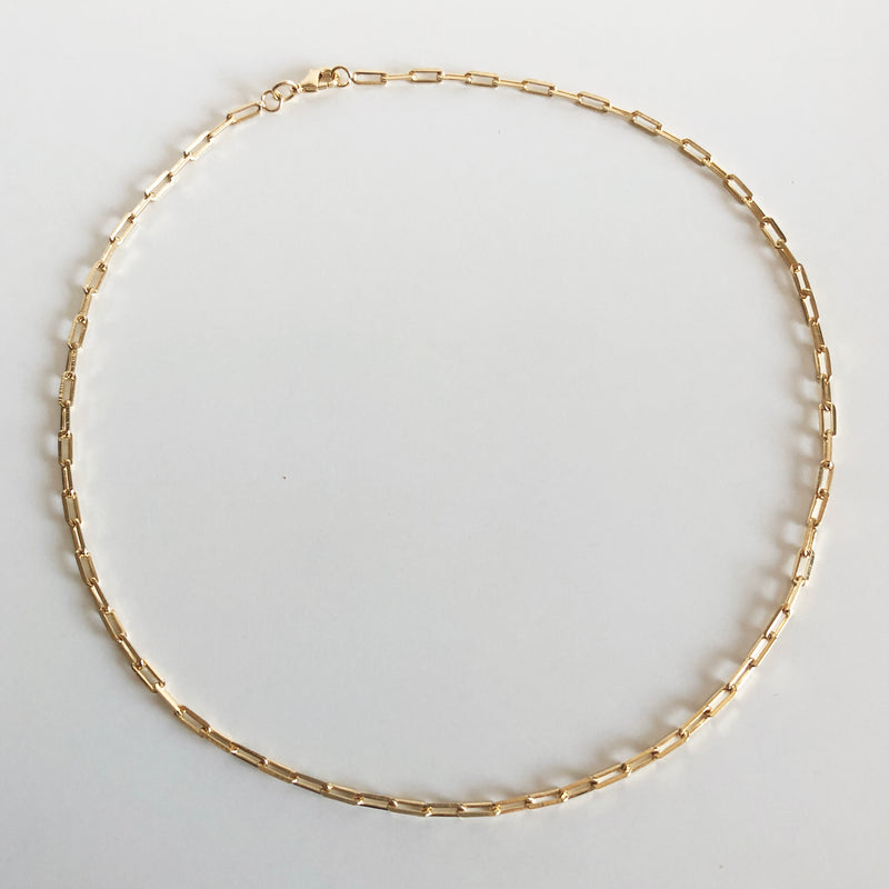 Osiris gold link chain flat lay