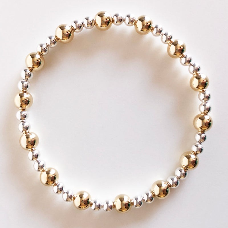 6mm gold and 4mm silver alternating beaded bracelet flat lay display