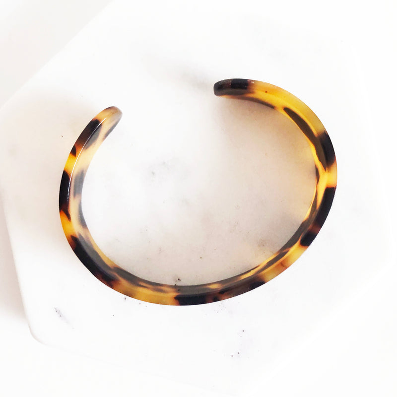 Classic tortoiseshell cellulose acetate acrylic cuff bracelet aerial view