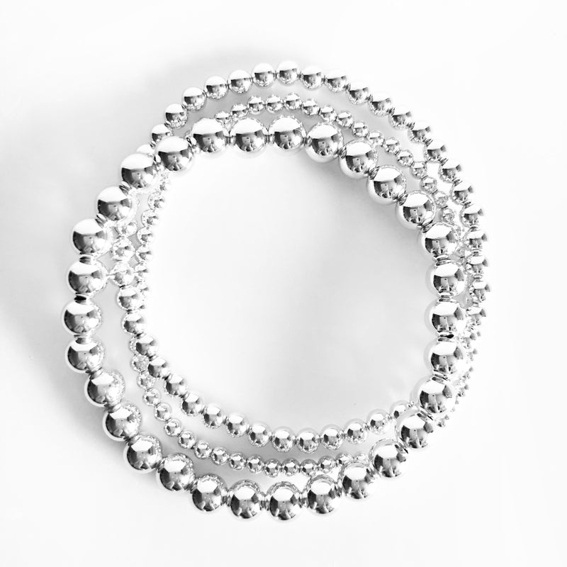 Sterling Silver stack of beaded bracelets in 3mm, 4mm, and 6mm bead sizes